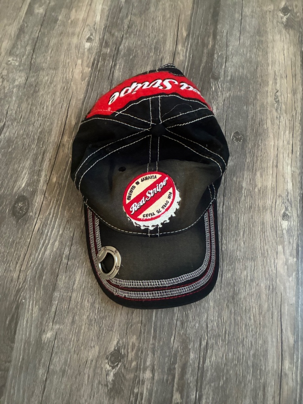 Embroidered Black Cap with Metal Ring